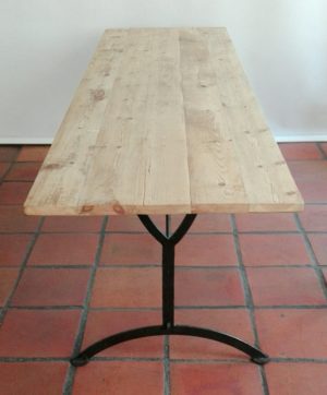 Table made from reclaimed 19th century Oregon pine and metal base