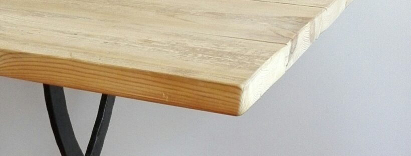 Table made from reclaimed 19th century Oregon pine and metal base