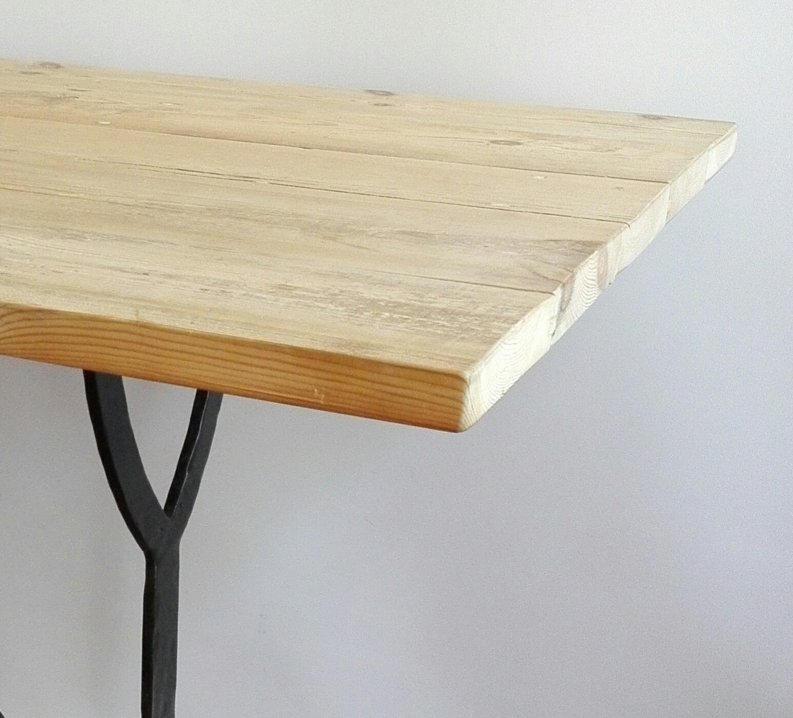 Table made from reclaimed 19th century Oregon pine and metal base