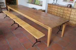 Pair of benches made from reclaimed 19th century Oregon pine benches on steel base