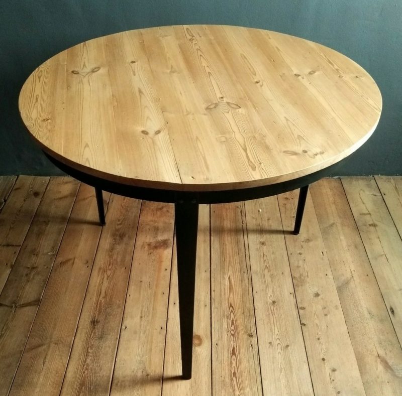 Round threelegged table made from reclaimed oregon pine and steel