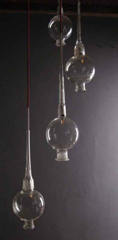 Photo of Hanging lights created by Riaan Chambers from reclaimed laboratory glass
